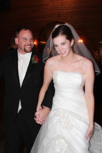 a bride and groom holding hands